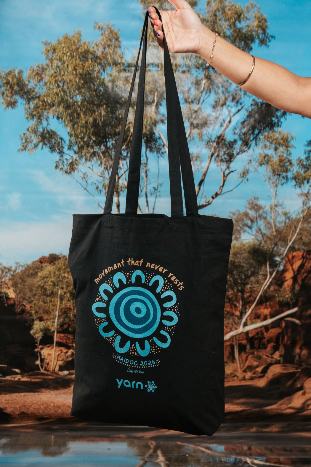Movement That Never Rests NAIDOC Week 2026 Tote Bag Black Long Handle Cotton Tote Bag