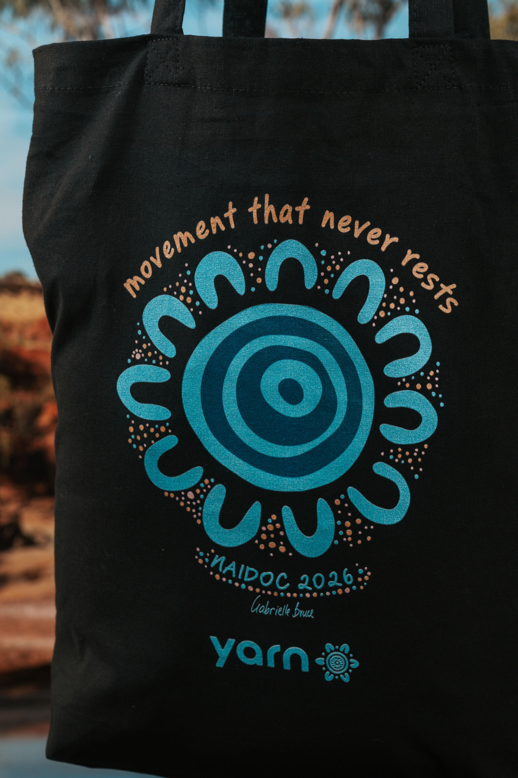 Movement That Never Rests NAIDOC Week 2026 Tote Bag Black Long Handle Cotton Tote Bag