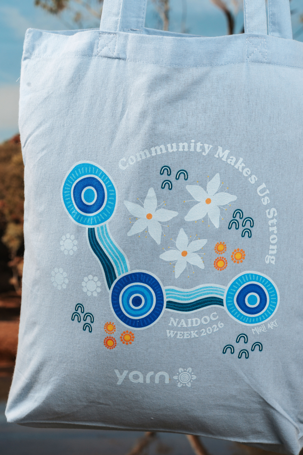 Community Makes Us Strong NAIDOC Week 2026 Tote Bag Sky Blue Long Handle Cotton Tote Bag